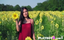 Cute small tits Asian teen Kimiko posing in sunflower field in red dress