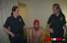 Horny MILF cops in uniforms are banging a black suspect in a cheap hotel room.