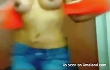 Latina with fake boobs putting on a webcam show