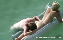 Horny couple having sex while swimming