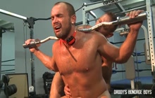 Bondage weights tied to his balls at the gym